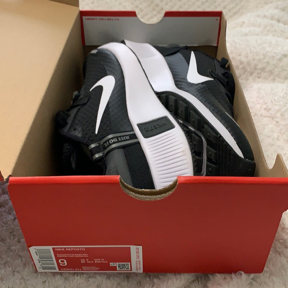 Brand new never worn Nike Reposto shoes. Black whit and smoke gray.